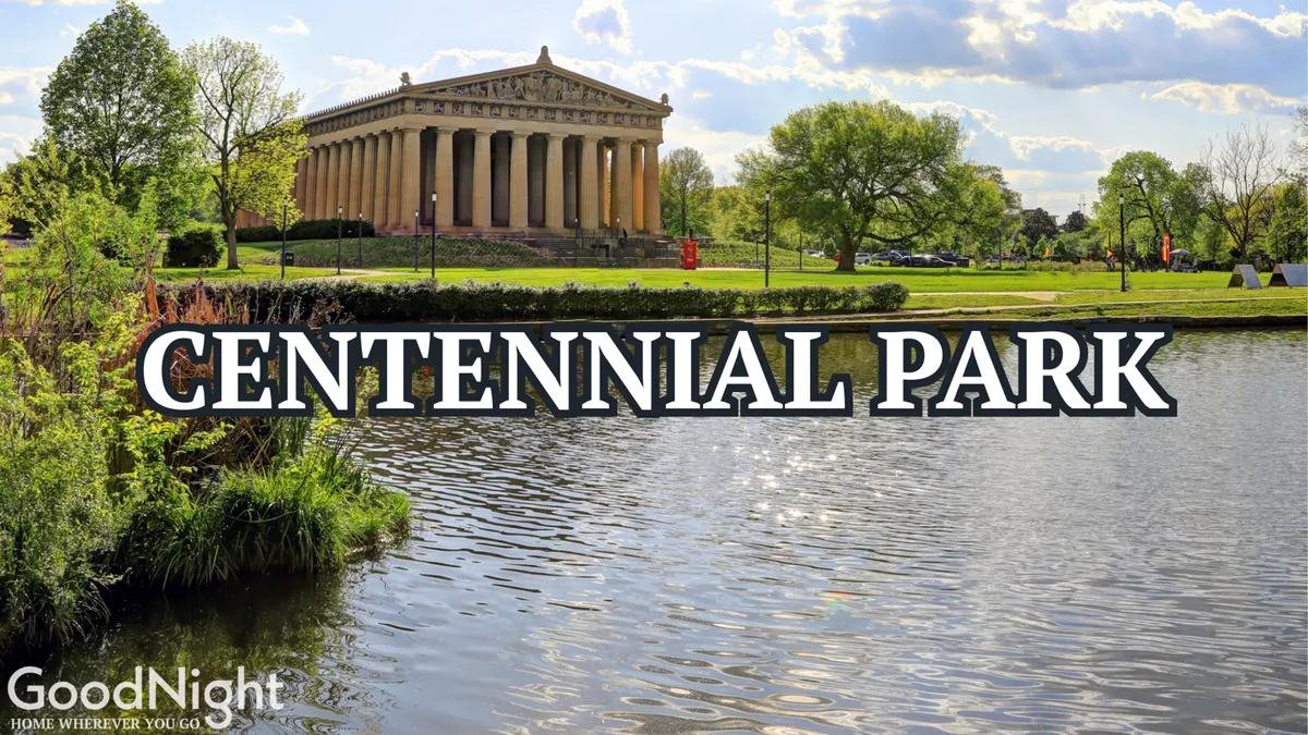 A serene shot of the Parthenon in Centennial Park reflecting over a tranquil water surface, surrounded by lush greenery and open lawns. The image conveys peaceful moments perfect for picnics, walks, and outdoor play, framed by one of Nashville's most beloved landmarks.